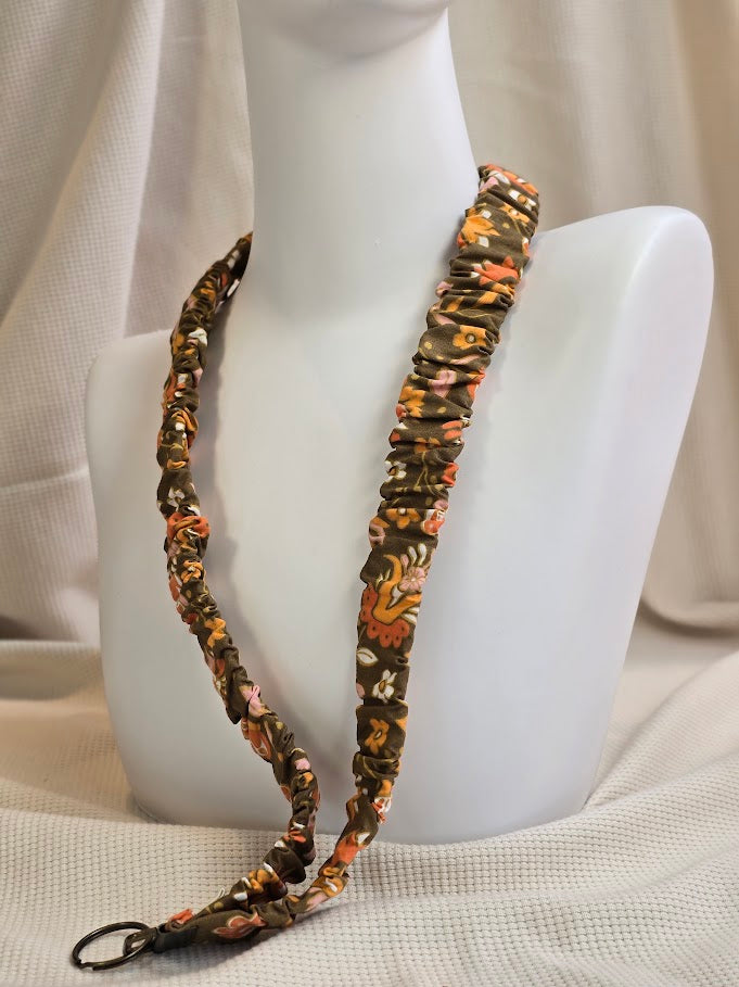 Olijfgroen met geel, oranje, wit bloemenprint telefoonkoord, -keycord en -sleutelhangers